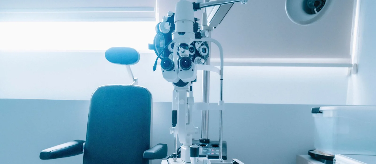 Optometry examination lane with exam chair, phoropter and slit lamp