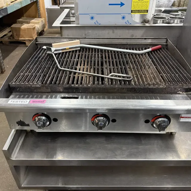 Gas charbroiler on a stainless equipment stand