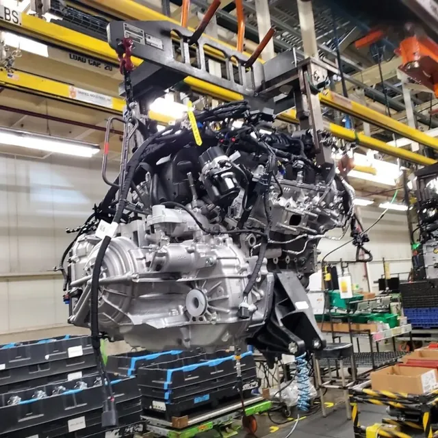 Engine and transmission assembly on an overhead carrier in an automotive plant