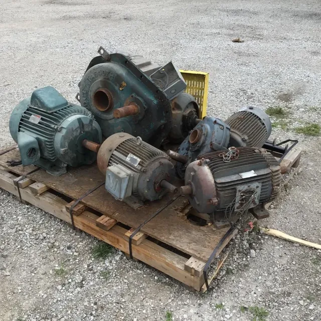 Used electric motors and gear reducers strapped to a pallet