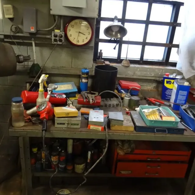 Shop workbench with hand tools, drill sets and a tool chest