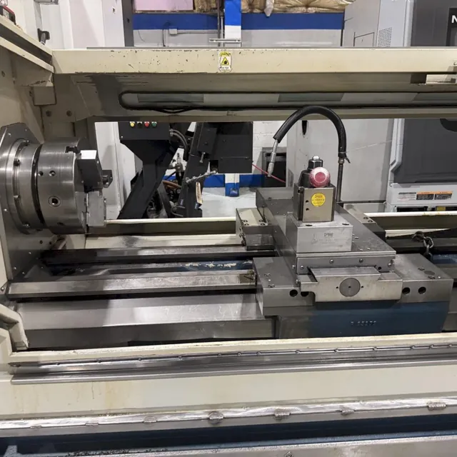 CNC lathe with chuck, tool post and bed ways