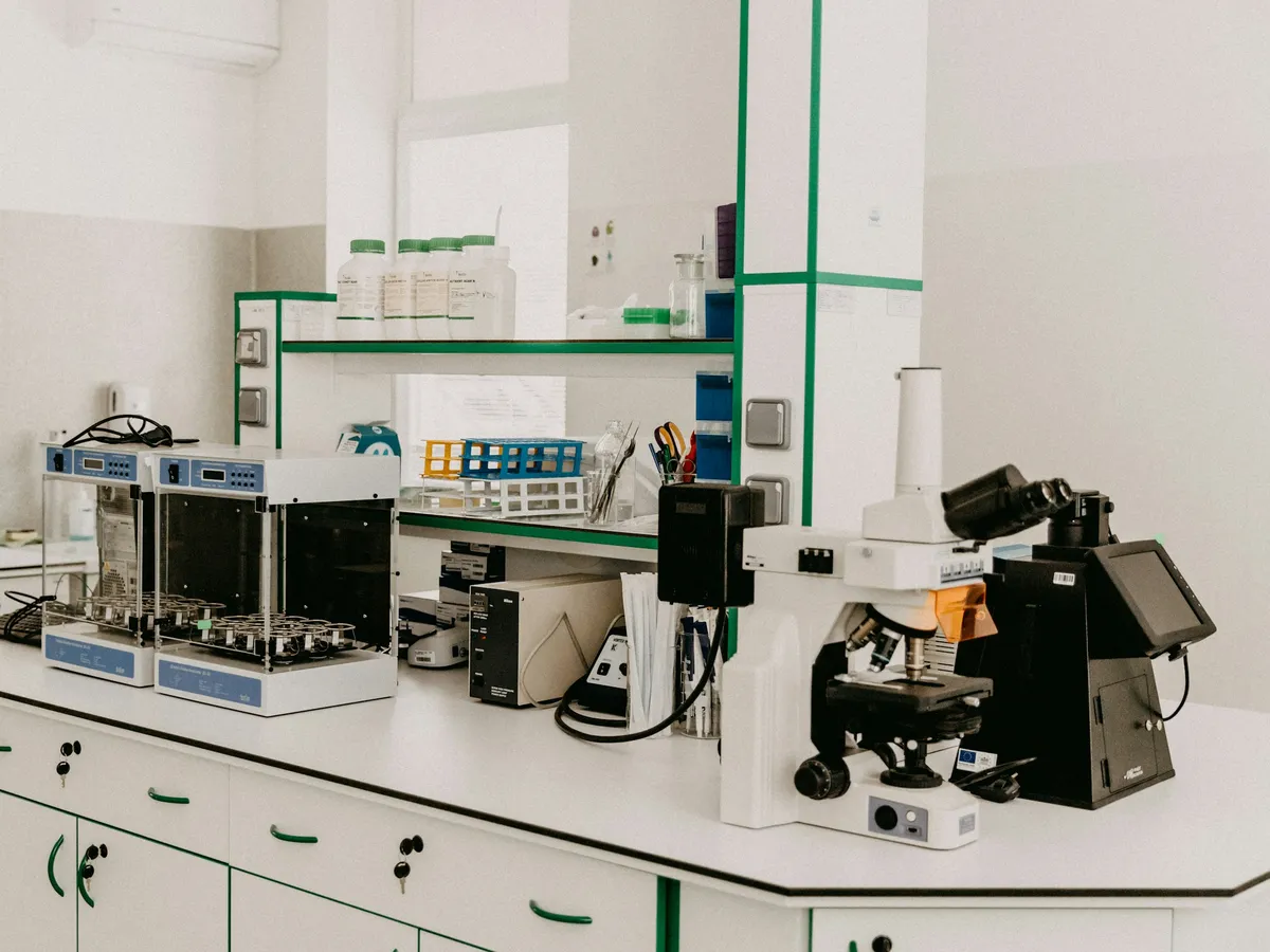Laboratory bench with a research microscope and bench instruments