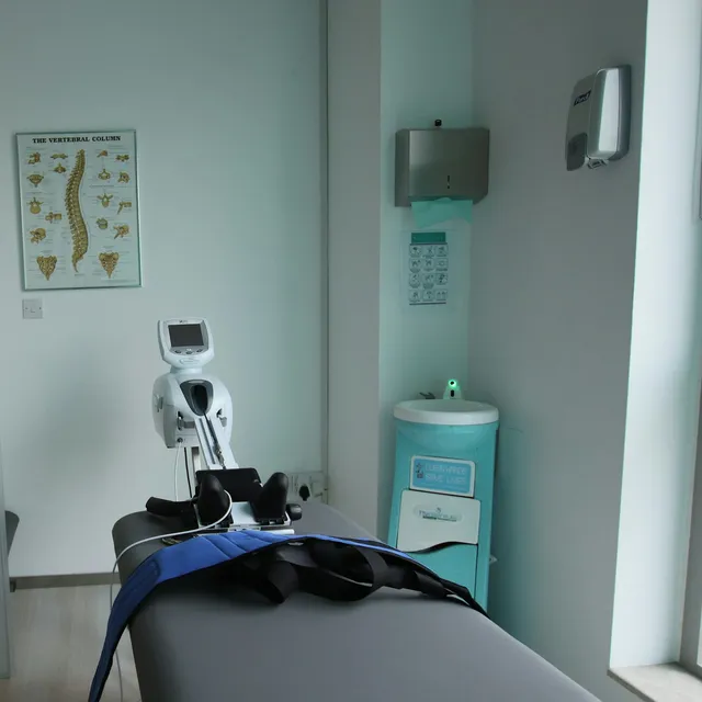 Spinal traction unit on a physical therapy treatment table